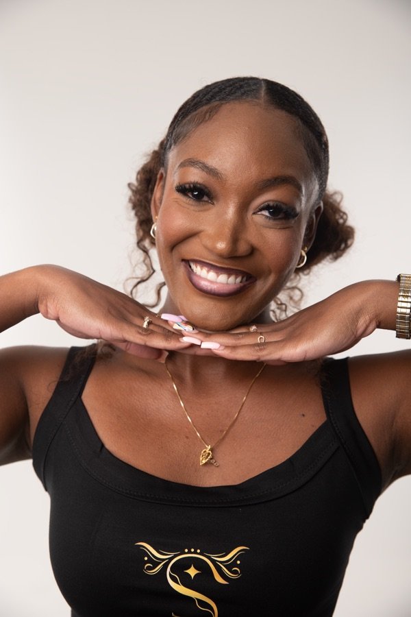 A client smiling, lashes finished